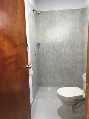 a bathroom with a toilet and a shower at Hostal Cartagena Sun in Cartagena de Indias