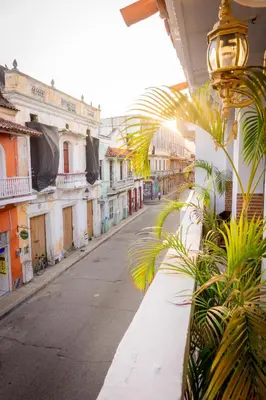 an empty street in a city with buildings at Hotel Mangata in Cartagena de Indias