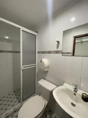 a bathroom with a toilet and a sink at Hotel Mangata in Cartagena de Indias