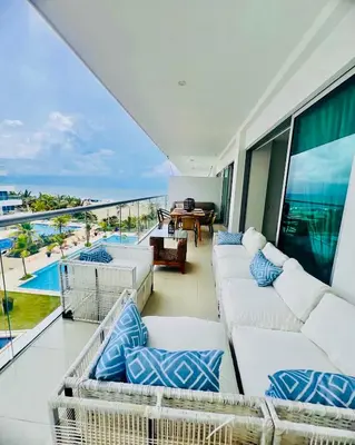 a balcony with couches and a view of the ocean at MORROS EPIC luxury beach in Cartagena de Indias