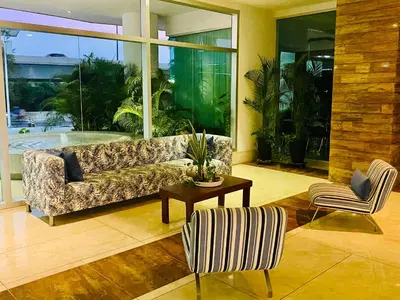 a living room with a couch and a table and chairs at MORROS EPIC luxury beach in Cartagena de Indias