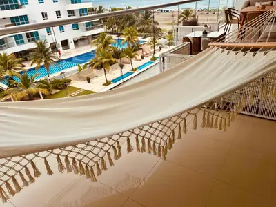 a hammock on the balcony of a resort at MORROS EPIC luxury beach in Cartagena de Indias