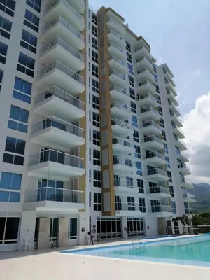 a large apartment building with a pool in front of it at Hermoso Apto con vista a la sierra y a Cabo Tortuga en el sector del Irotama en Santa Marta in Gaira