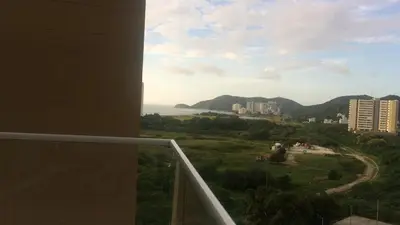 a view of the ocean from a balcony of a building at Hermoso Apto con vista a la sierra y a Cabo Tortuga en el sector del Irotama en Santa Marta in Gaira