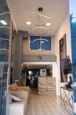 a lobby with two chandeliers in a building at Hermosa Habitación cerca al Centro histórico in Cartagena de Indias