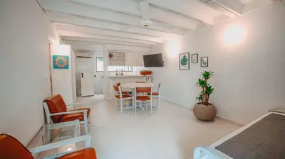 a room with a kitchen and a table and chairs at Marbelo Coveñas by Bernalo Hotels in Coveñas