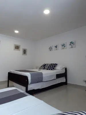 a bedroom with two beds in a room at Shark 1514 Nuevo Conquistador in Cartagena de Indias