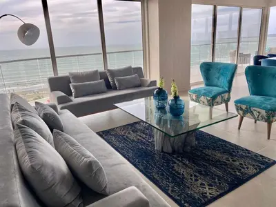 a living room with a couch and a table and chairs at Serena del Mar, Morros IO in Cartagena de Indias