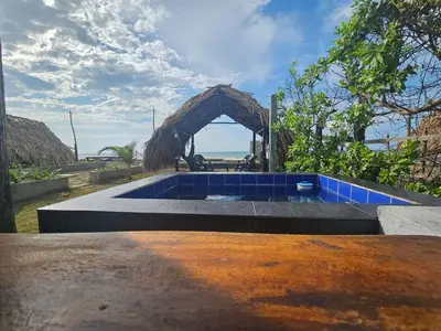 a swimming pool with a blue tiledagame at AGUAMARINA House in San Bernardo del Viento