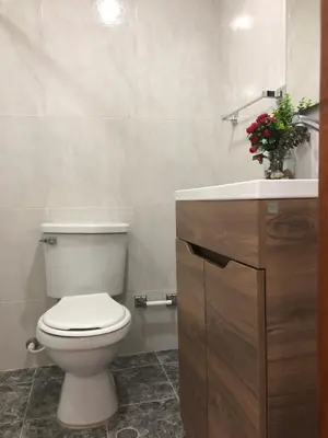 a bathroom with a white toilet and a sink at La 10B in Cartagena de Indias