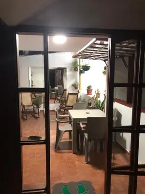 a view of a dining room with a table and chairs at La 10B in Cartagena de Indias