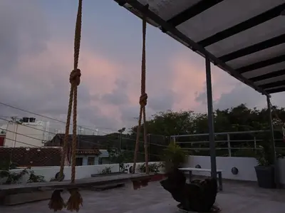 a view from the roof of a house with swings at La 10B in Cartagena de Indias