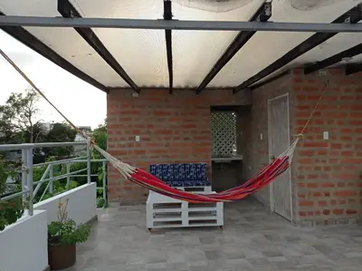 a hammock on the patio of a house at La 10B in Cartagena de Indias