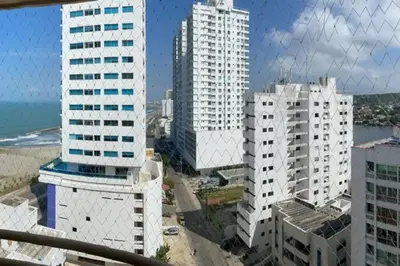 a view of a city with tall buildings and the ocean at Oferta frente a la playa Cartagena . En, Sp, It. in Cartagena de Indias