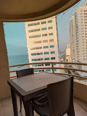 a table and chairs on the balcony of a building at Oferta frente a la playa Cartagena . En, Sp, It. in Cartagena de Indias