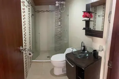 a bathroom with a toilet and a sink at Oferta frente a la playa Cartagena . En, Sp, It. in Cartagena de Indias