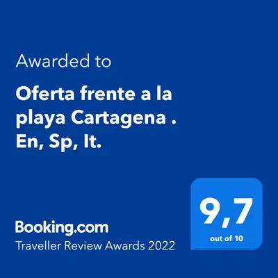 a screenshot of a phone with the text wanted to offer a la playaza car at Oferta frente a la playa Cartagena . En, Sp, It. in Cartagena de Indias
