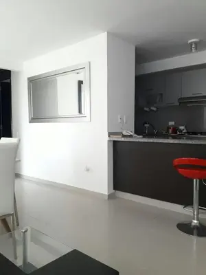 a kitchen with a red stool in a room at Rincon 94- Barranquilla- Rio Alto in Barranquilla