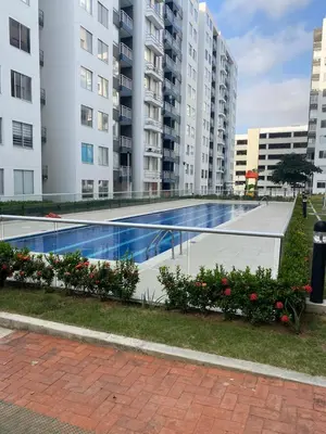 a swimming pool in a city with tall buildings at Torino Barranquilla- Miramar in Barranquilla