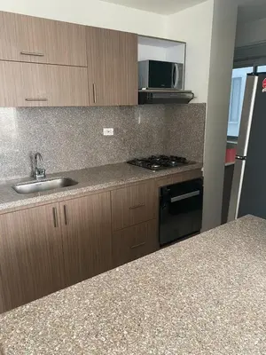 a kitchen with a sink and a stove top oven at Torino Barranquilla- Miramar in Barranquilla