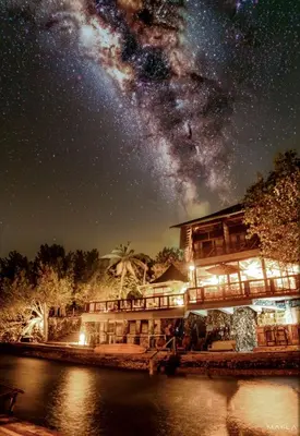 a house with the milky way in the sky at Rosario EcoHotel - Islas del Rosario in Isla Grande