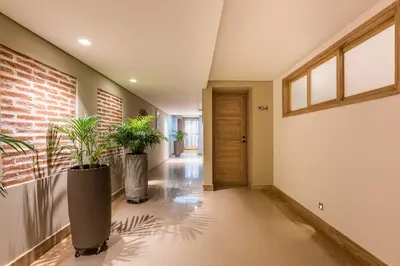 a hallway with two potted plants in a house at Apartamentos casa Gimani in Cartagena de Indias