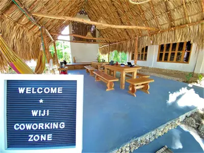 a resort with a sign that says welcome with a working zone at Isla Fuerte - Wiji Island House in Isla Fuerte