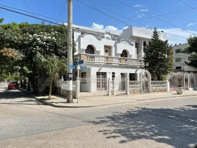 a white house with a white fence on a street at MAR uno in Cartagena de Indias