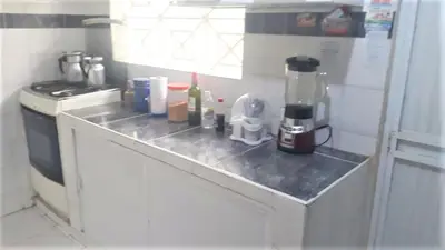 a kitchen counter with a coffee maker on it at HABITACION PRIVADA EN CASA DE MIS PADRES in Barranquilla