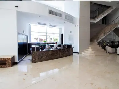 a lobby with stairs and a bar in a building at Apartamento Palmetto Eliptic - Best Seaview in Cartagena de Indias