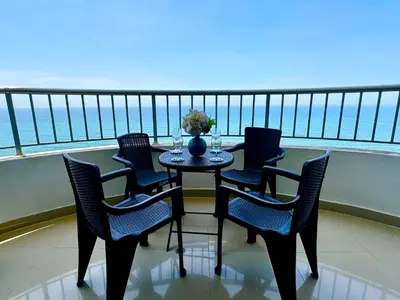 a table and chairs on a balcony with the ocean at Apartamento con vista al mar piso 19 Bocagrande in Cartagena de Indias
