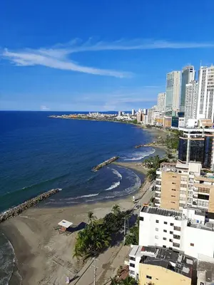 a view of a beach with buildings and the ocean at Apartamento con vista al mar piso 19 Bocagrande in Cartagena de Indias