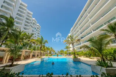 an image of a swimming pool in front of a building at Morros Epic 2 Bedrooms Beachfront by Inmobiliaria MFR in Cartagena de Indias
