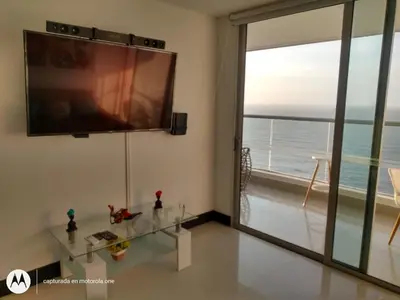 a living room with a large flat screen tv on the wall at Caminando hacia la playa in Cartagena de Indias
