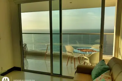 a living room with a view of the ocean at Caminando hacia la playa in Cartagena de Indias