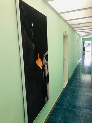 a hallway with a large picture on the wall at Tita’s Airport Hotel in Cartagena de Indias