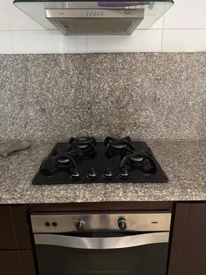 a black stove top oven in a kitchen at Apartaestudio amplio in Barranquilla
