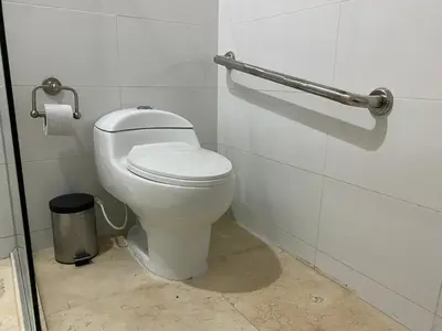 a bathroom with a white toilet in a stall at Apartaestudio amplio in Barranquilla