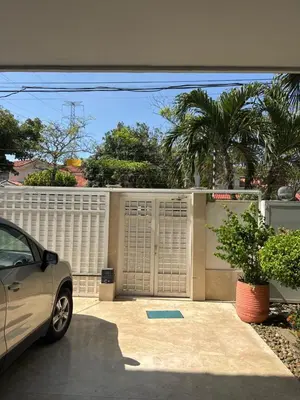 a car parked in front of a garage at Apartaestudio amplio in Barranquilla