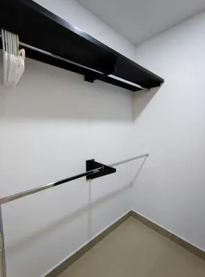 a black light hanging on a white wall at Atlantis Suites -Amoblados Nuevos sector Buenavista in Barranquilla