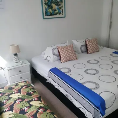 a small bedroom with a bed and a night stand at Cómodo Apartamento en Bocagrande Cartagena 1503 in Cartagena de Indias
