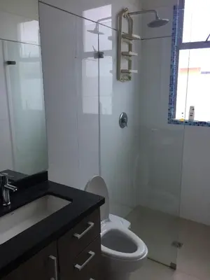 a bathroom with a toilet and a glass shower at Casa de Playa en Marina Puerto Velero in Barranquilla