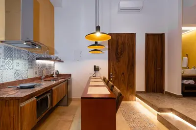 a kitchen with a wooden counter top in a room at Ganem Suites Cartagena in Cartagena de Indias