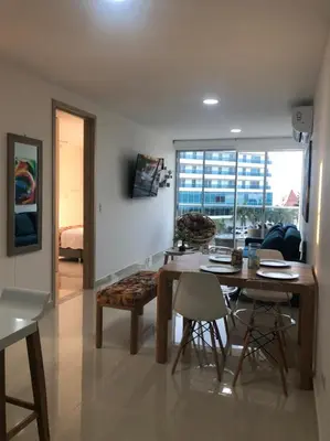 a living room with a dining room table and chairs at NUEVO PRECIOSO APARTAMENTO in Cartagena de Indias