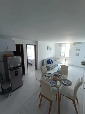 a kitchen and living room with a table and chairs at Amazing ocean view Apartment in El Laguito Cartagena in Cartagena de Indias