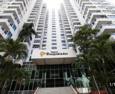 a large white apartment building with a sign on it at Loft playa y mar in Cartagena de Indias