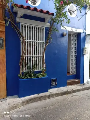 a blue building with a window and a blue wall at Casa Azulita RNT# 64888 in Cartagena de Indias