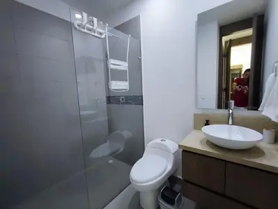 a bathroom with a toilet and a sink and a shower at Spiaggia di Cartagena primera línea de playa in Cartagena de Indias