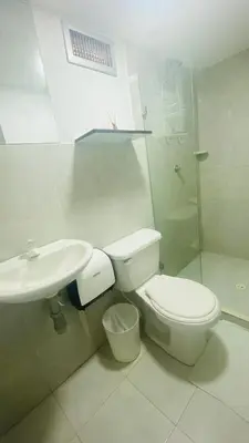 a bathroom with a toilet and a sink and a shower at House Marfito Airport in Cartagena de Indias
