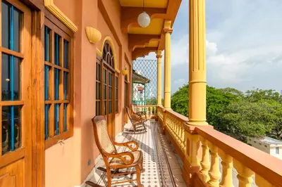 a balcony of a house with chairs on it at Casa Morales Getsemaní in Cartagena de Indias